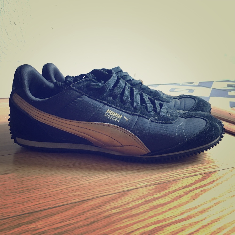 Black & gold Pumas, size 8